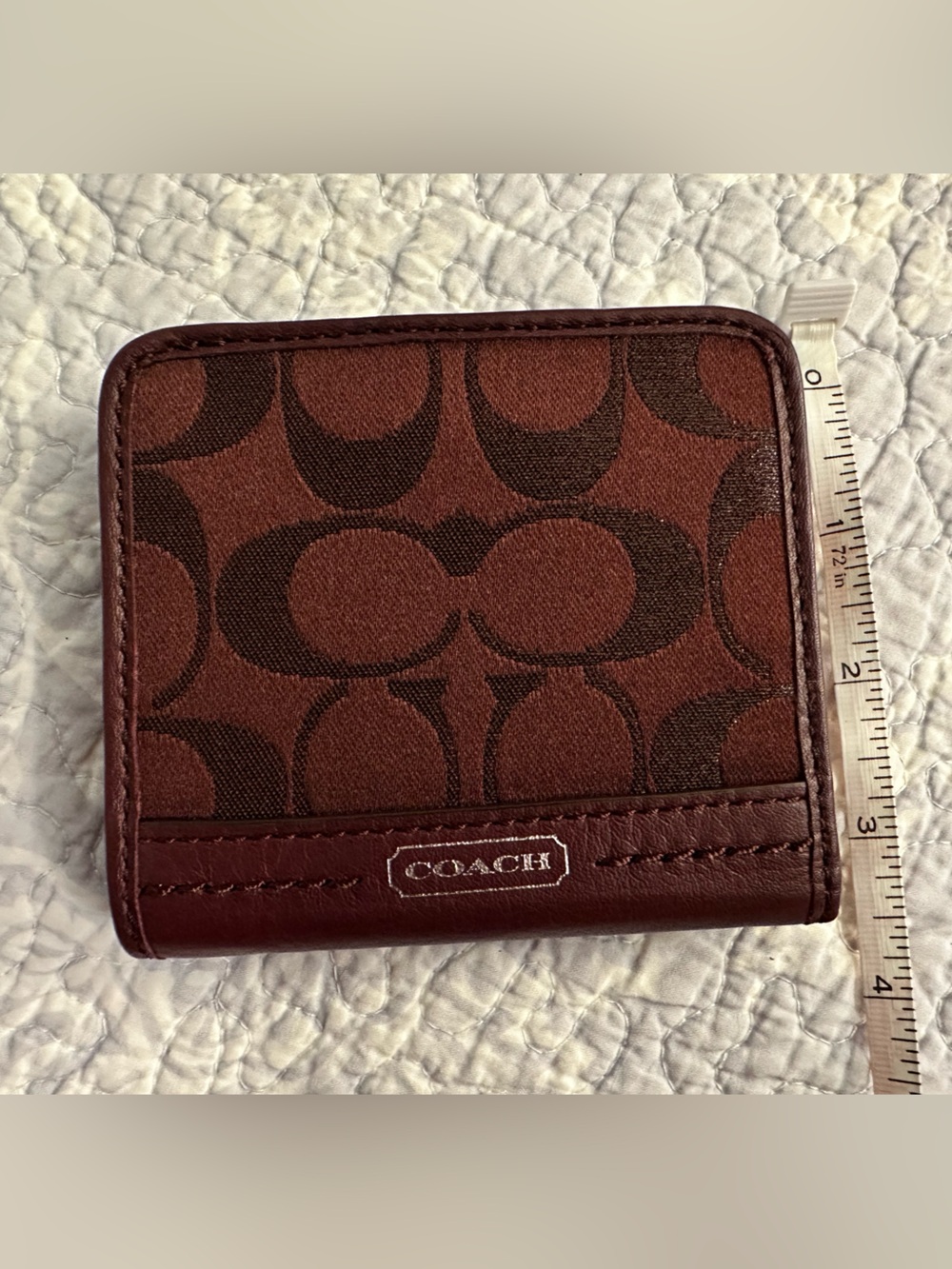 COACH Women’s Signature Canvas Bi-Fold Wallet in Burgundy